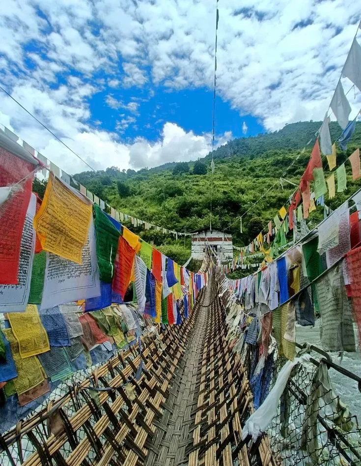Suspension bridge with fluttering prayer flags